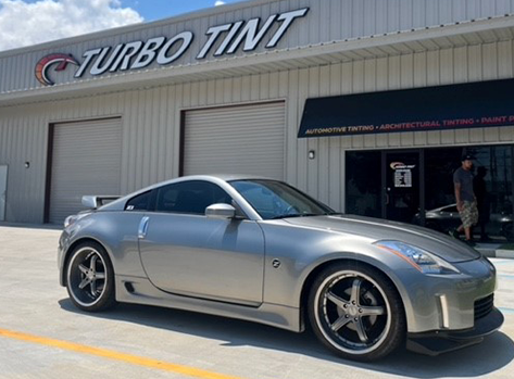 Silver car window tint store front