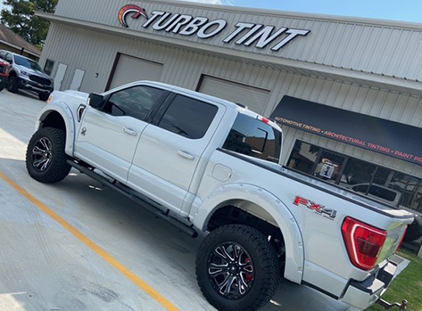 white truck window tint store front